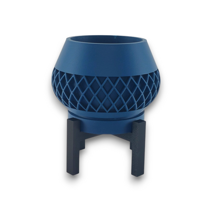 Blue PLA planter – 3D printed with bowl-shaped body and diamond lattice texture, elevated on black four-legged stand
