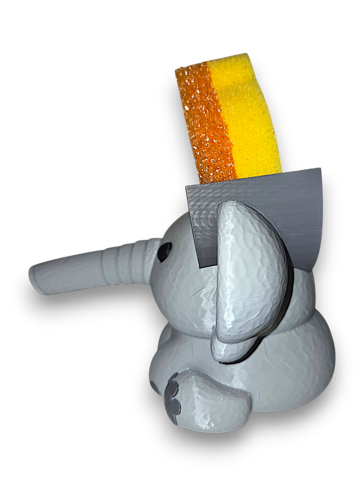 Gray 3D printed elephant sponge holder with a hollow trunk and flat top on a white background
