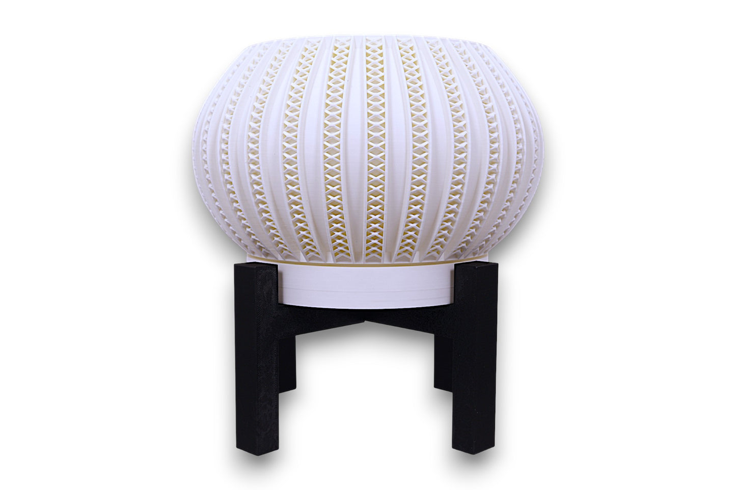 White sculptural planter with gold-accented lattice texture on black stand