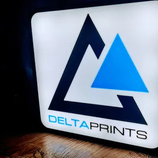 Delta Prints logo on a white background