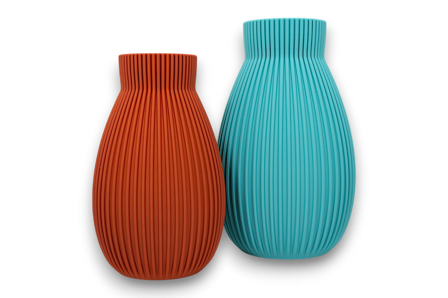 terracotta and turquoise PLA vases – 3D printed with vertical ribbed texture and narrow necks, displayed side by side
