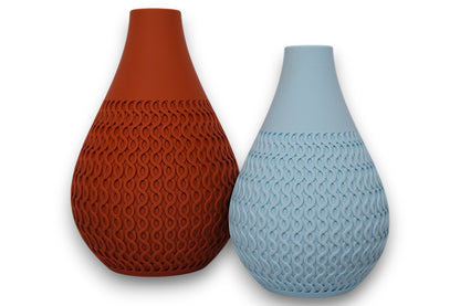 Terracotta and light blue PLA vases – 3D printed with teardrop shape and wavy interlocking texture on lower halves

