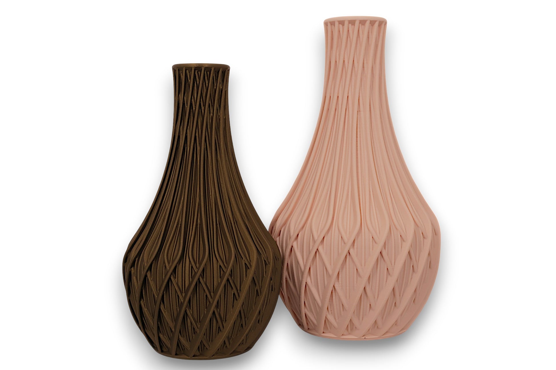 Beige and bronze PLA vases – 3D printed with sculptural leaf and geometric textures, shown side by side

