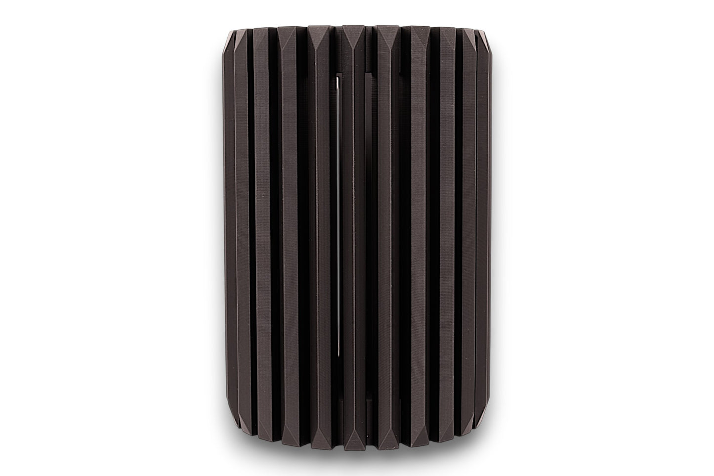 Black cylindrical vase with ribbed texture on a white background