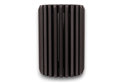 Black cylindrical vase with ribbed texture on a white background