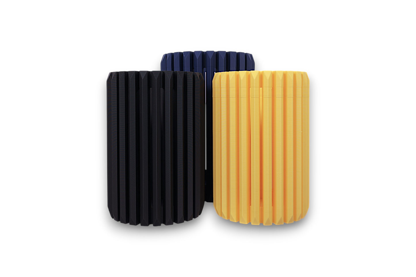 Black, dark blue, and yellow PLA Vases – 3D printed with ridged surfaces and cylindrical forms, displayed upright in staggered layout
