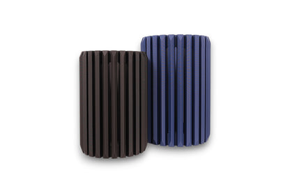 blue and black cylindrical vases with textured surfaces on a white background