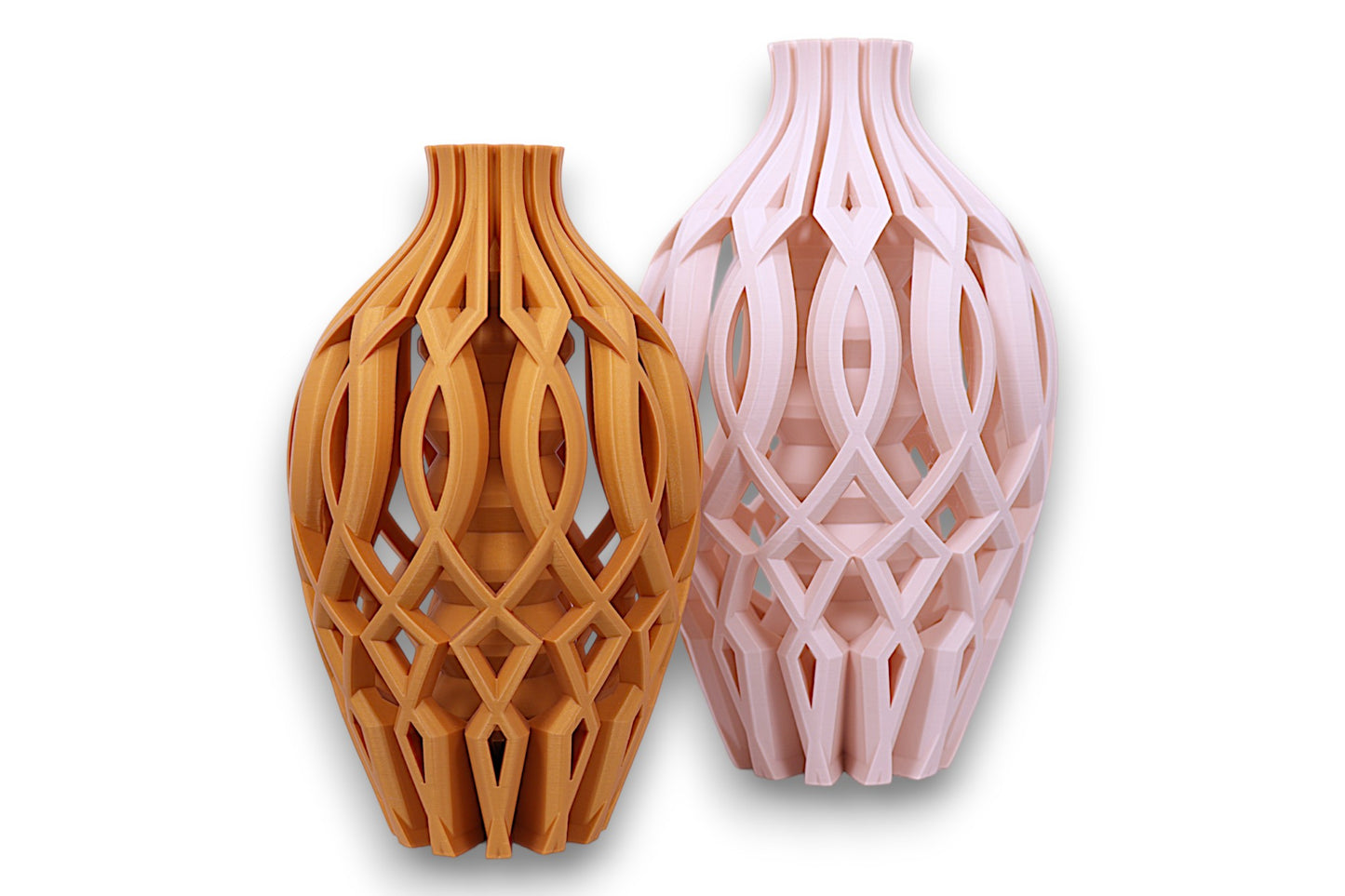 Two decorative vases with intricate lattice designs, one gold and one beige, on a white background.