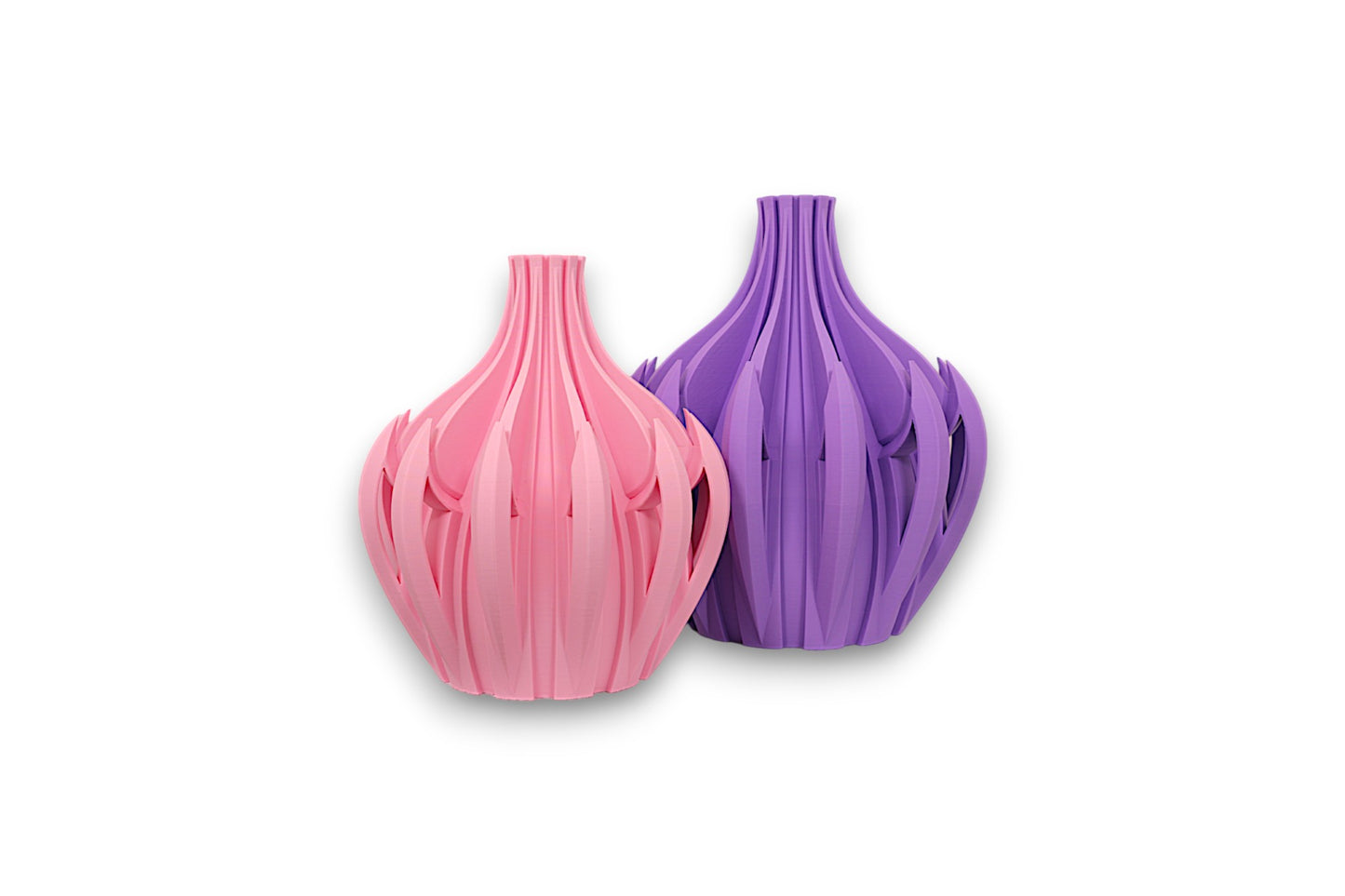 Pink and purple PLA vases – 3D printed with bulbous bases and vertical petal-like blades, displayed side by side

