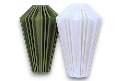Dark green and white PLA vases – 3D printed with tapered bodies and vertical faceted ridges, displayed side by side
