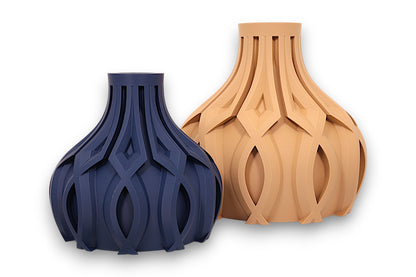 Dark blue and tan PLA vases – 3D printed with bulbous bases and interwoven lattice textures, displayed side by side
