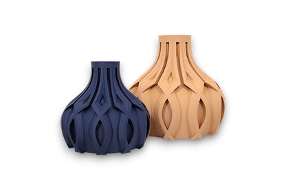 Dark blue and tan PLA vases – 3D printed with bulbous bases and interwoven lattice textures, displayed side by side
