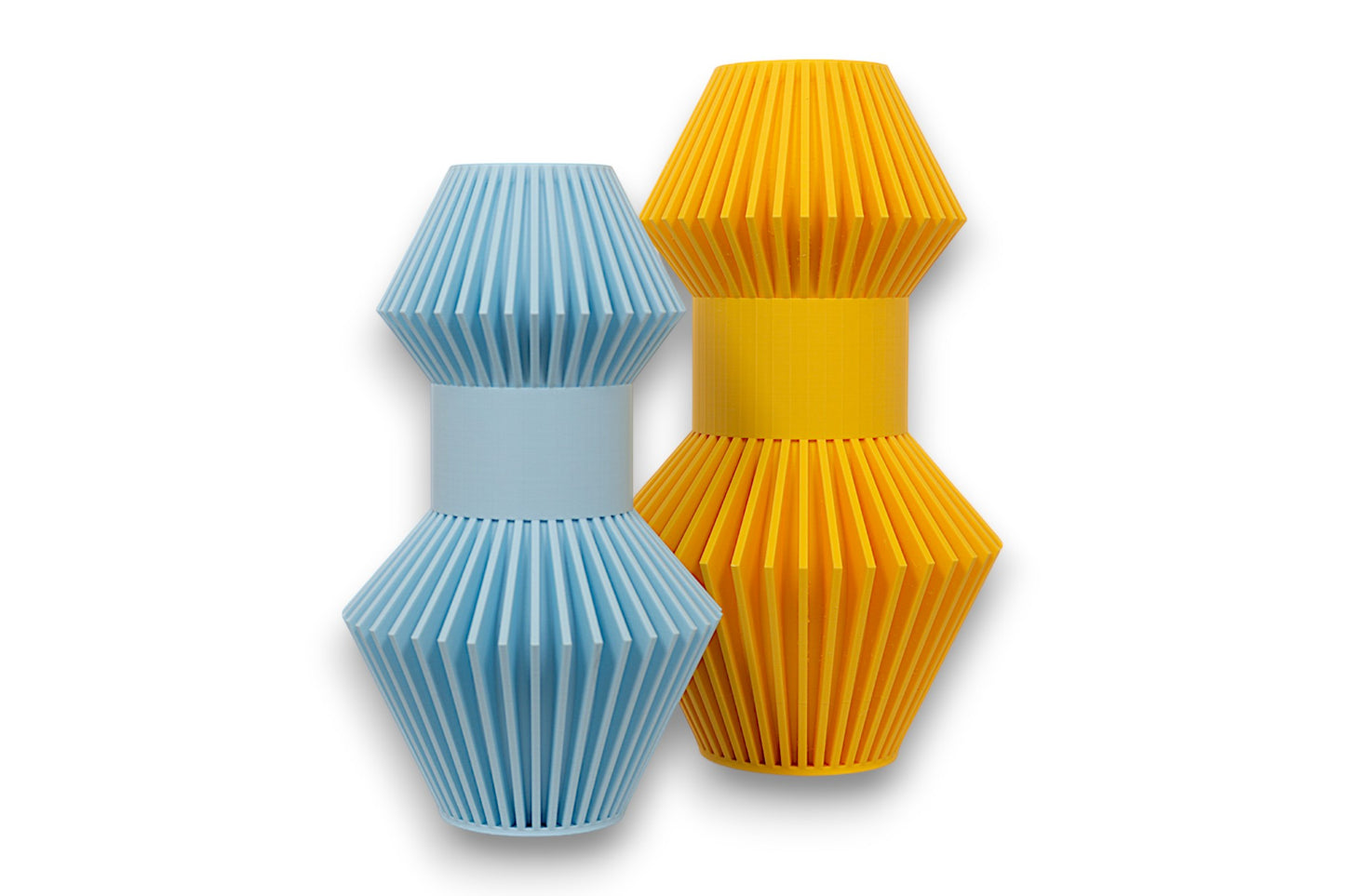 Yellow and light blue PLA sculptures – 3D printed with symmetrical slatted cone textures and cylindrical centers, shown side by side