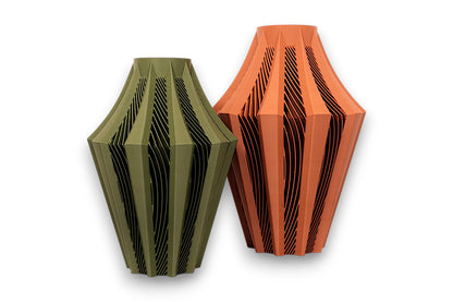 Olive green and Terracotta PLA vases – 3D printed with tapered forms and angular faceted panels, displayed side by side
