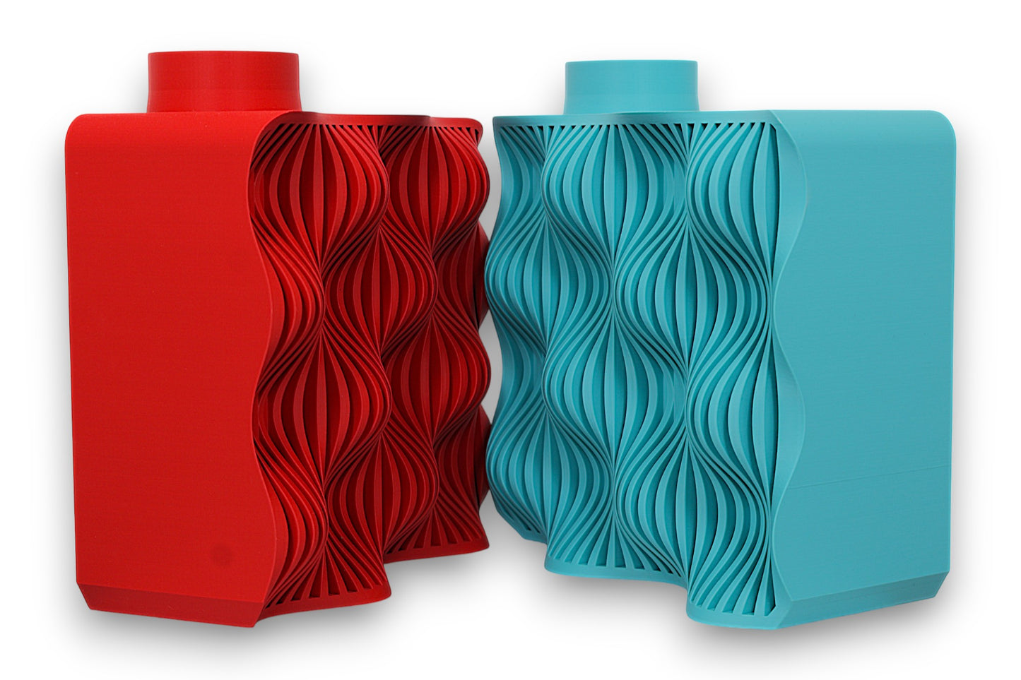 Red and turquoise PLA vases – 3D printed with cylindrical tops and rectangular bodies, each featuring undulating wave-textured front panels
