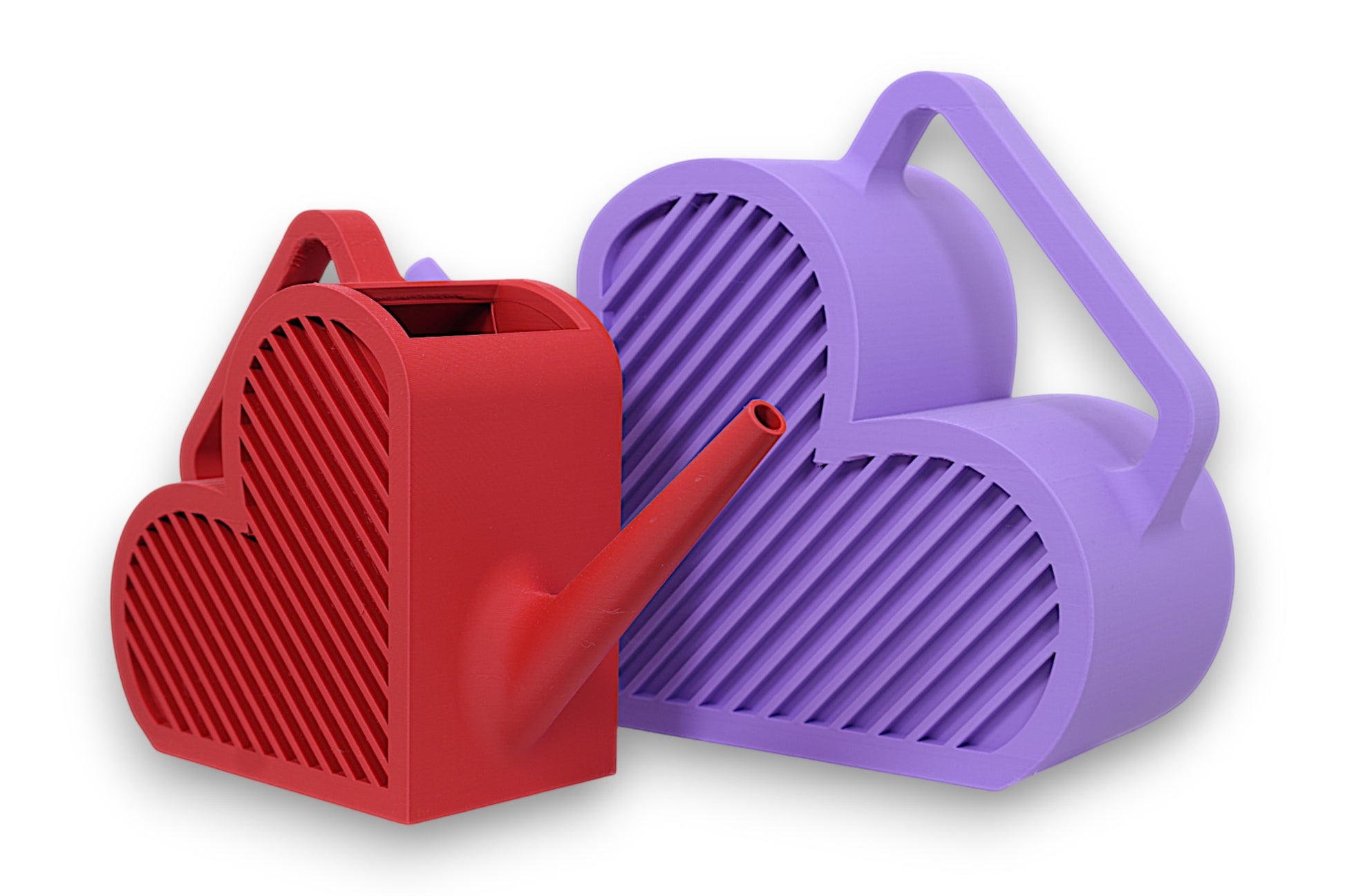 Red and purple PLA watering cans – 3D printed in heart shape with ribbed texture, shown side by side with angled spouts and integrated handles
