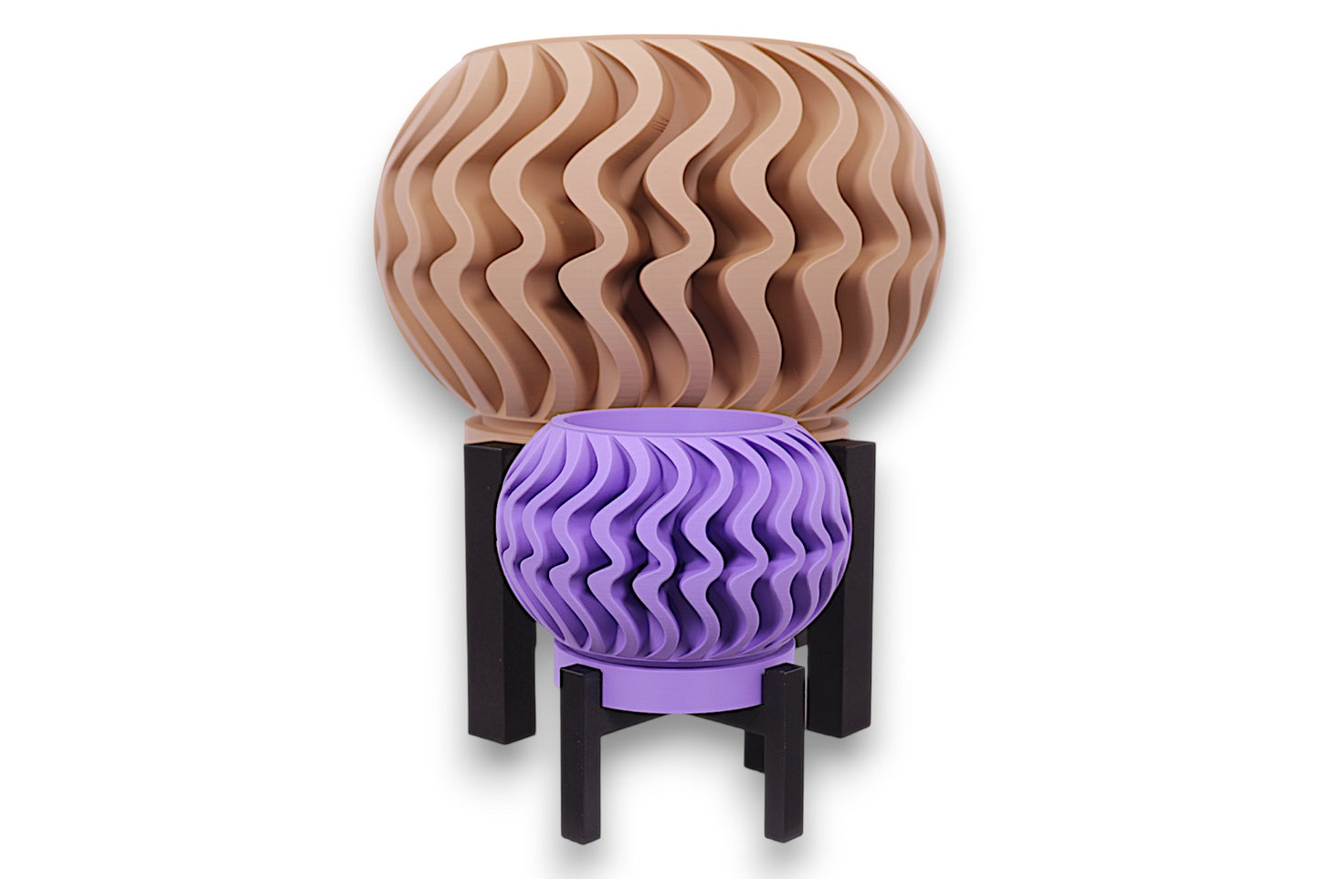 Purple and beige PLA planters – 3D printed with wavy vertical textures and rounded forms, displayed on black stands in staggered heights
