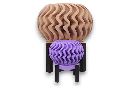Purple and beige PLA planters – 3D printed with wavy vertical textures and rounded forms, displayed on black stands in staggered heights