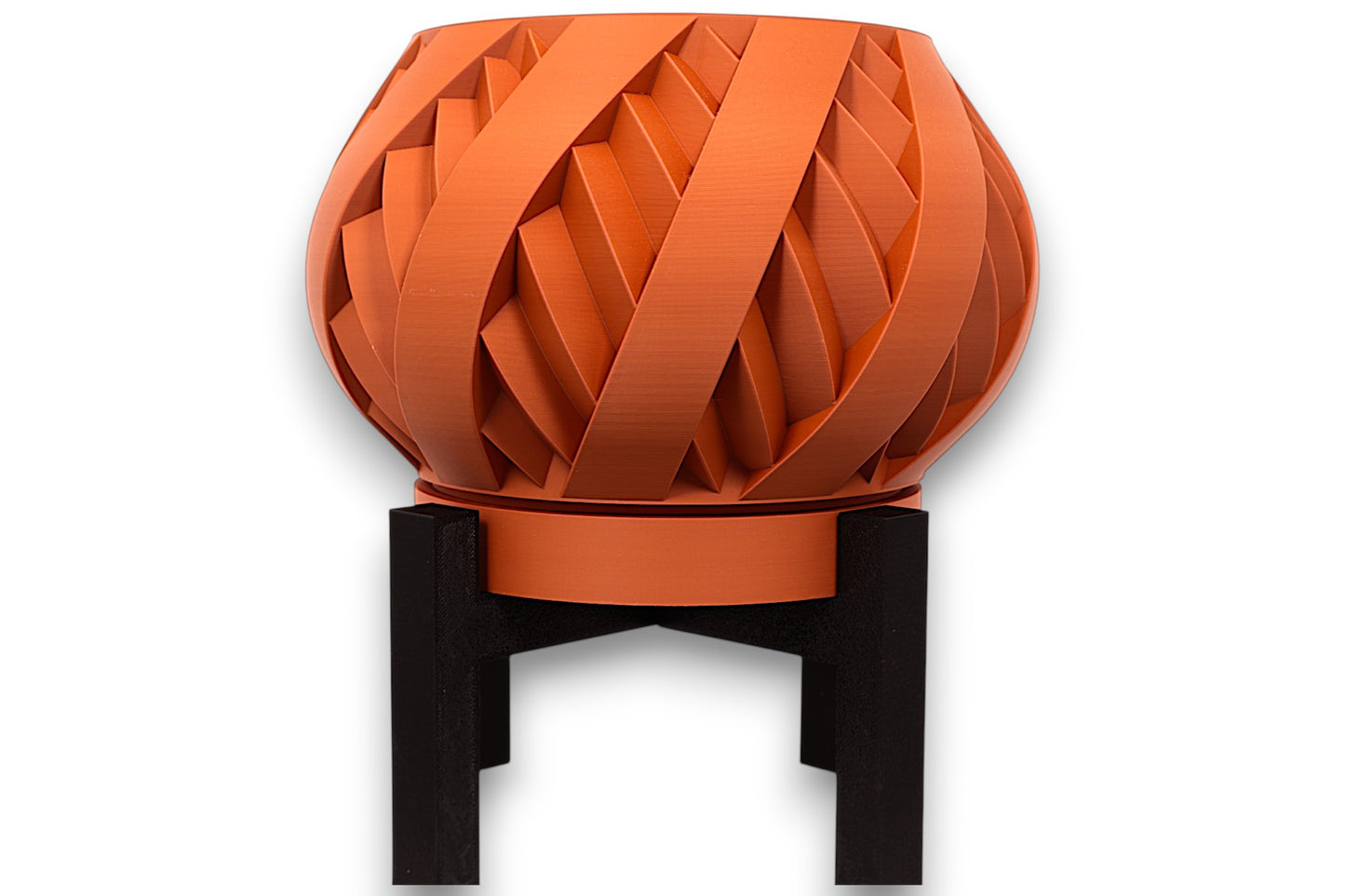 Terracotta PLA planter – 3D printed with interwoven ribbon texture and bulbous form, elevated on black four-legged stand
