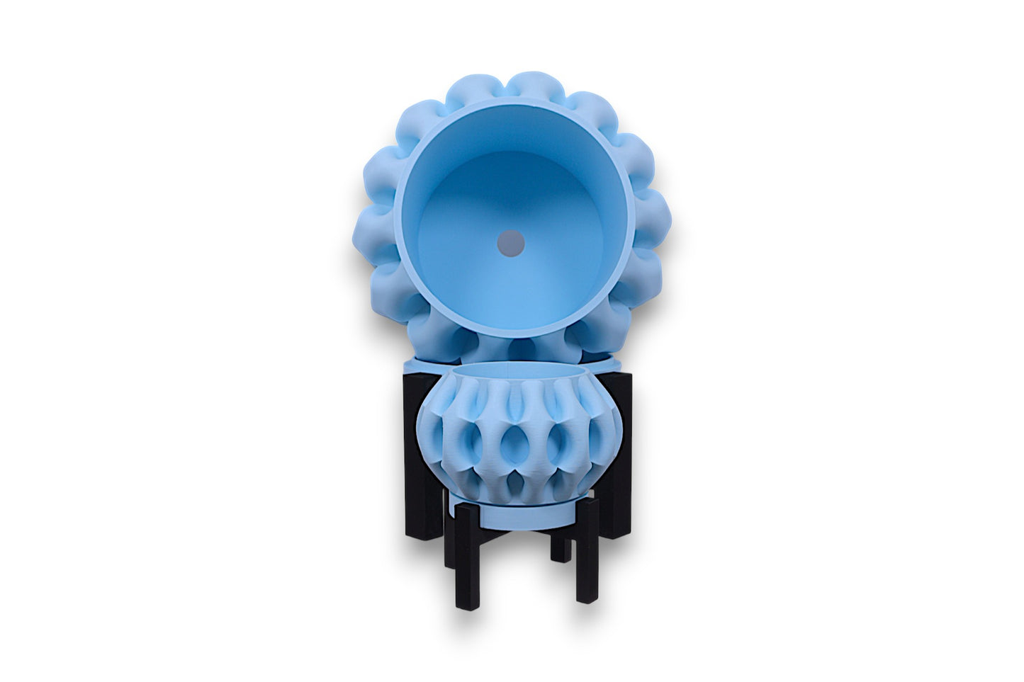 Two light blue PLA bowls – 3D printed with spherical bodies and rounded protrusions, stacked vertically on black angular stands