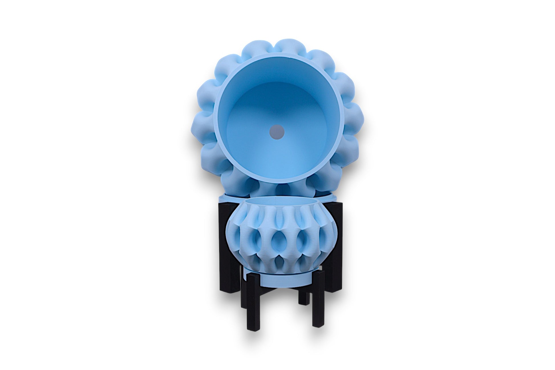Two light blue PLA bowls – 3D printed with spherical bodies and rounded protrusions, stacked vertically on black angular stands