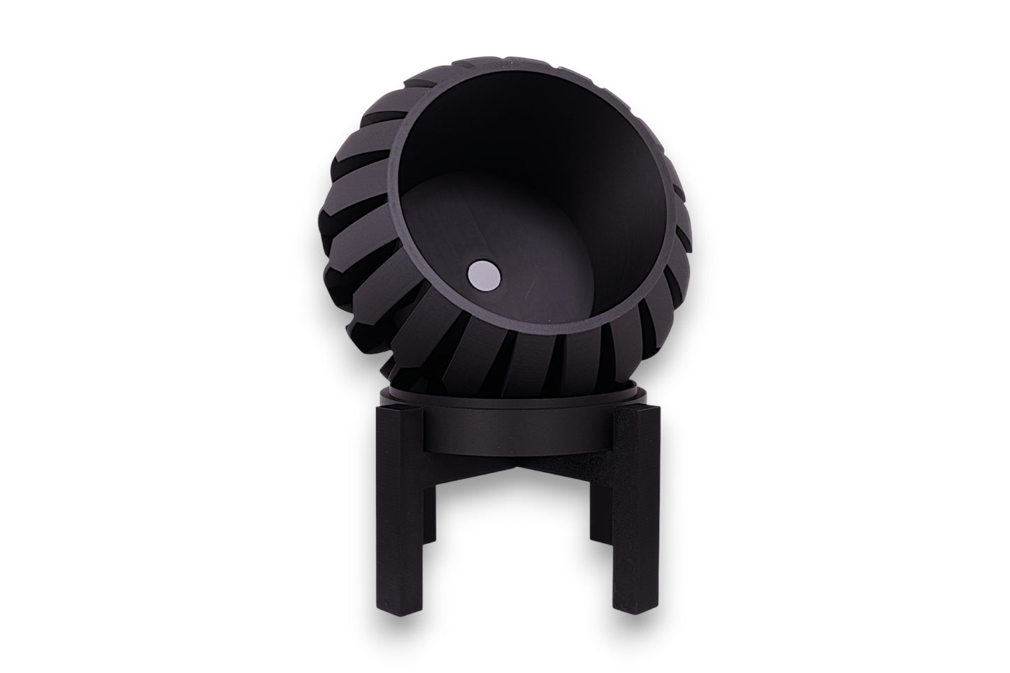 Black PLA planter – 3D printed with spherical body and vertical blade-like ridges, mounted on black four-legged stand
