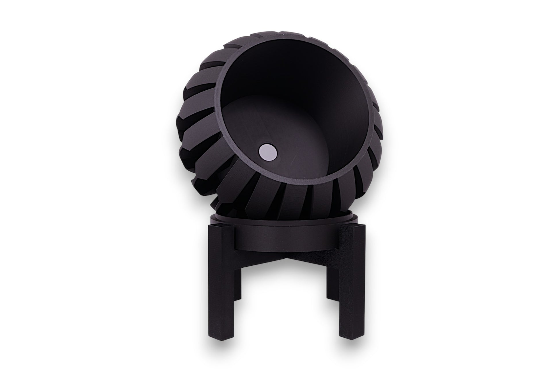 Black PLA planter – 3D printed with spherical body and vertical blade-like ridges, mounted on black four-legged stand
