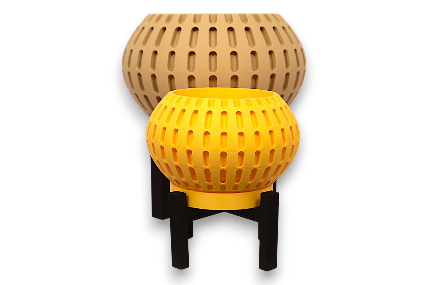Tan and Yellow PLA planters – 3D printed with spherical body and evenly spaced vertical oval cutouts, mounted on black four-legged stand
