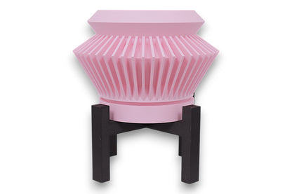 Pink PLA planter – 3D printed with flared body and vertical pleated ridges, mounted on black four-legged stand
