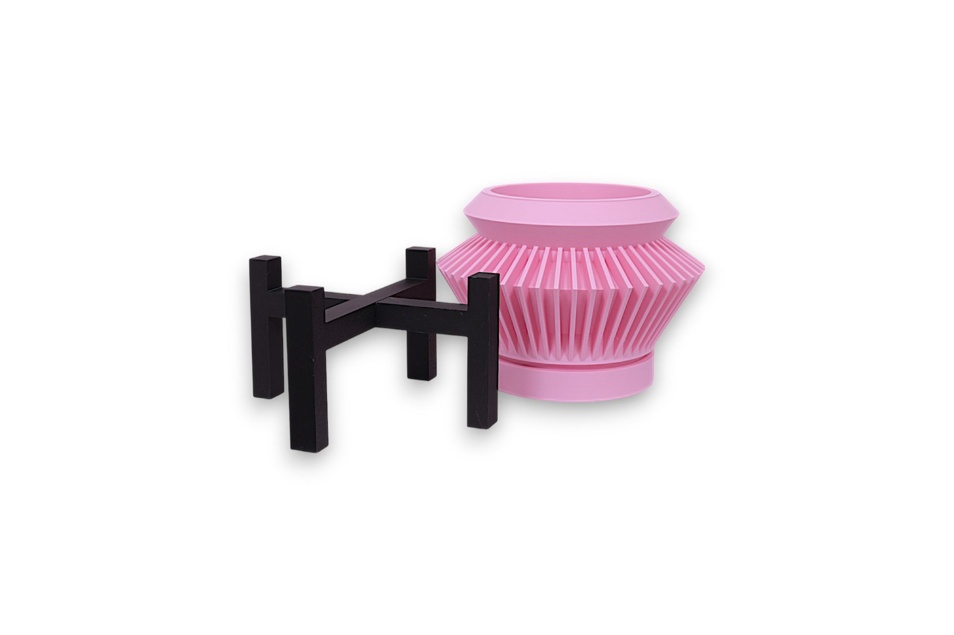 Pink PLA planter – 3D printed with wide opening and ribbed vertical texture, paired with black four-legged stand