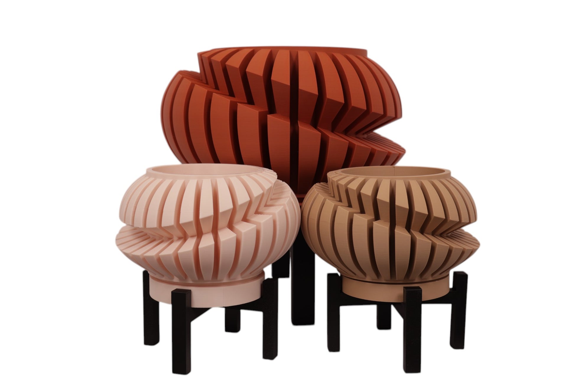 Beige, terracotta, and tan PLA planters – 3D printed with spiral slat textures, shown together on black stands in staggered heights

