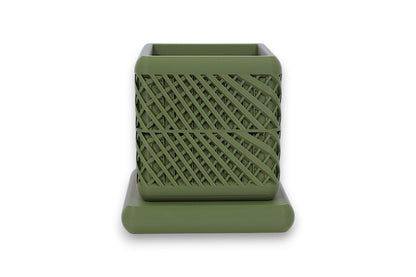 Green PLA square container – 3D printed with diagonal lattice texture, placed on matching base
