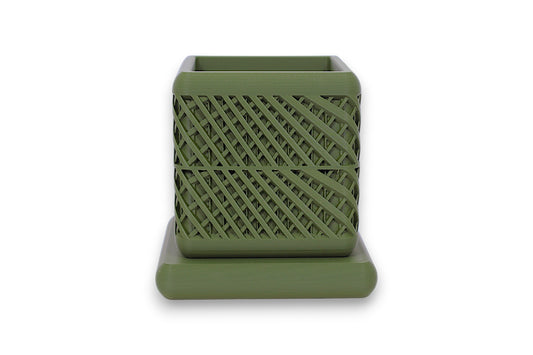 Green PLA square container – 3D printed with diagonal lattice texture, placed on matching base
