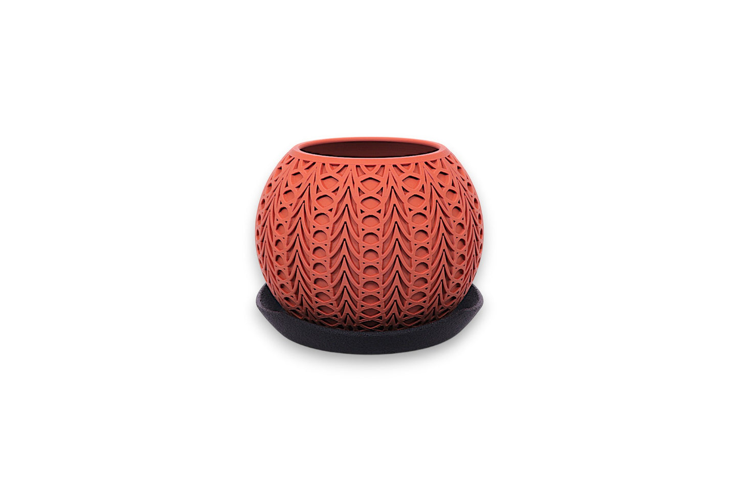 Terracotta PLA planter – 3D printed with symmetrical teardrop and oval cutouts, displayed on dark saucer
