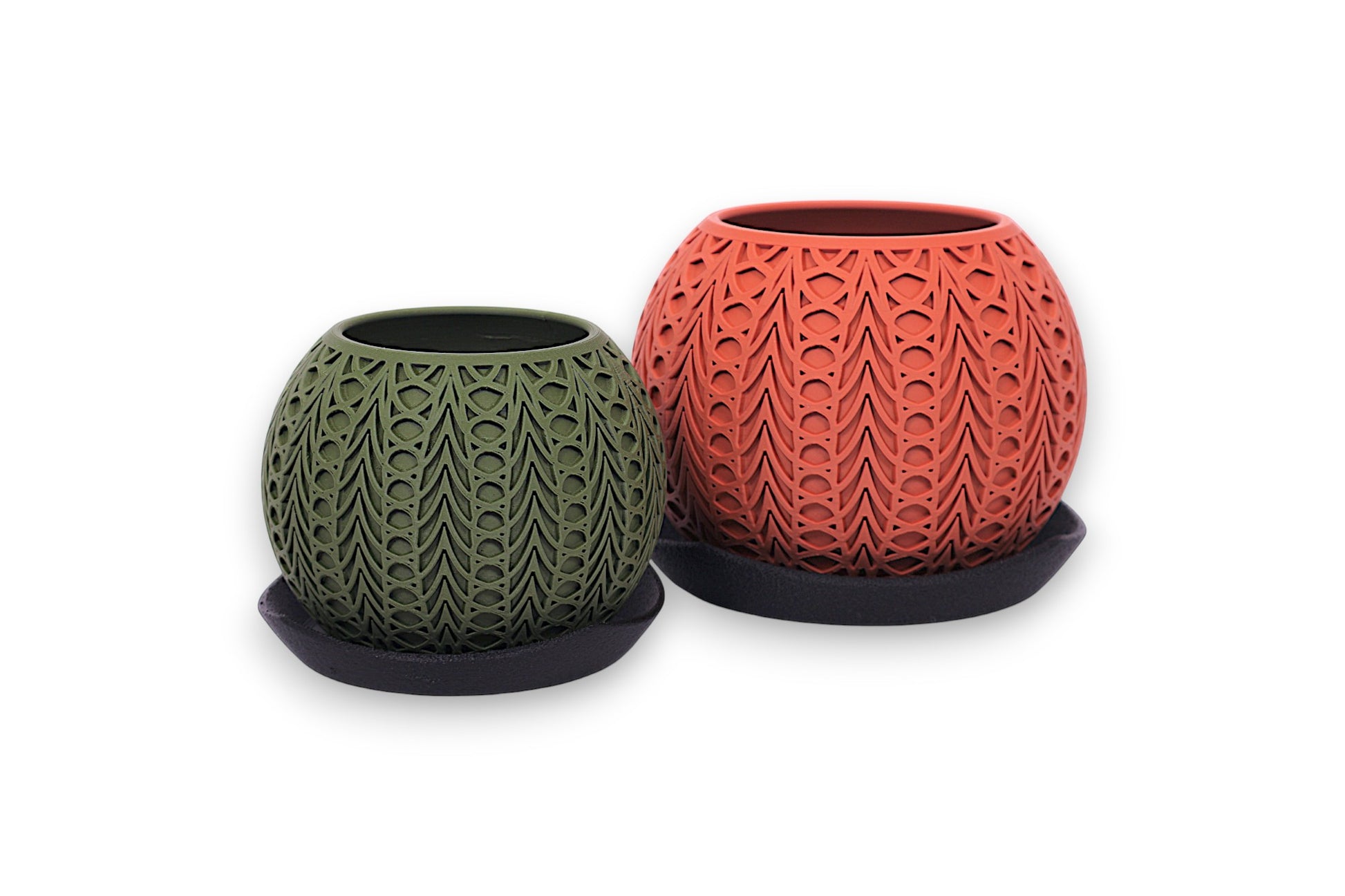 Two textured planters, one green and one orange, on a white background