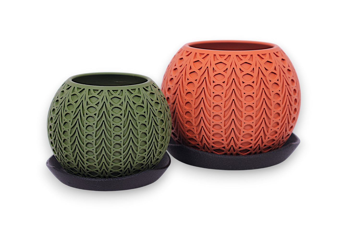Green and terracotta PLA planters – 3D printed with stylized feather texture, each placed on black saucer in staggered sizes
