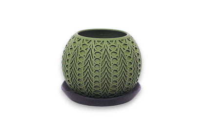 Green textured ceramic pot on a white background