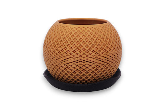 Gold PLA decorative planter – 3D printed with diamond lattice texture, placed on black saucer
