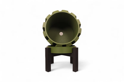 Green planter with notched rim and dark interior mounted on black tripod stand