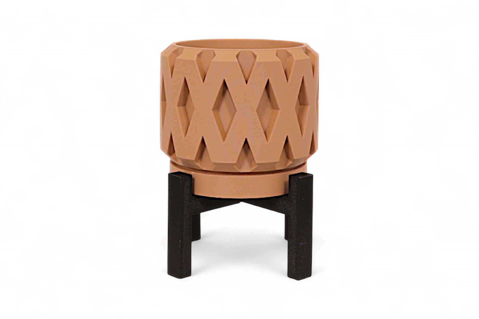 Brown diamond-textured planter on black four-legged stand