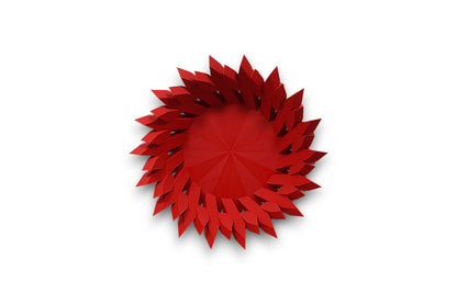 Red catch-all tray with folded petal-like spikes radiating from circular center
