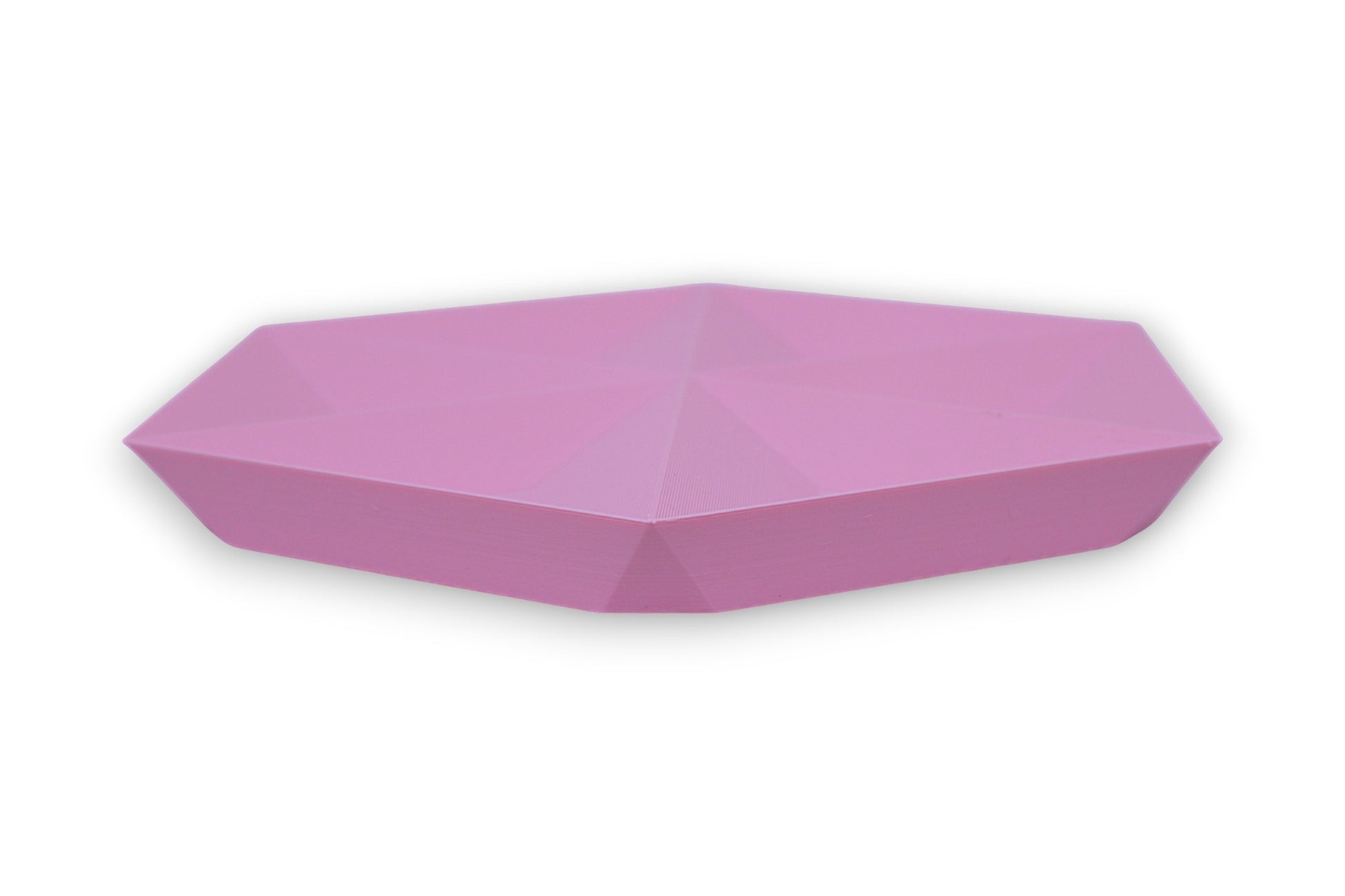 Pink faceted catch-all tray with hexagonal base and tapered sides