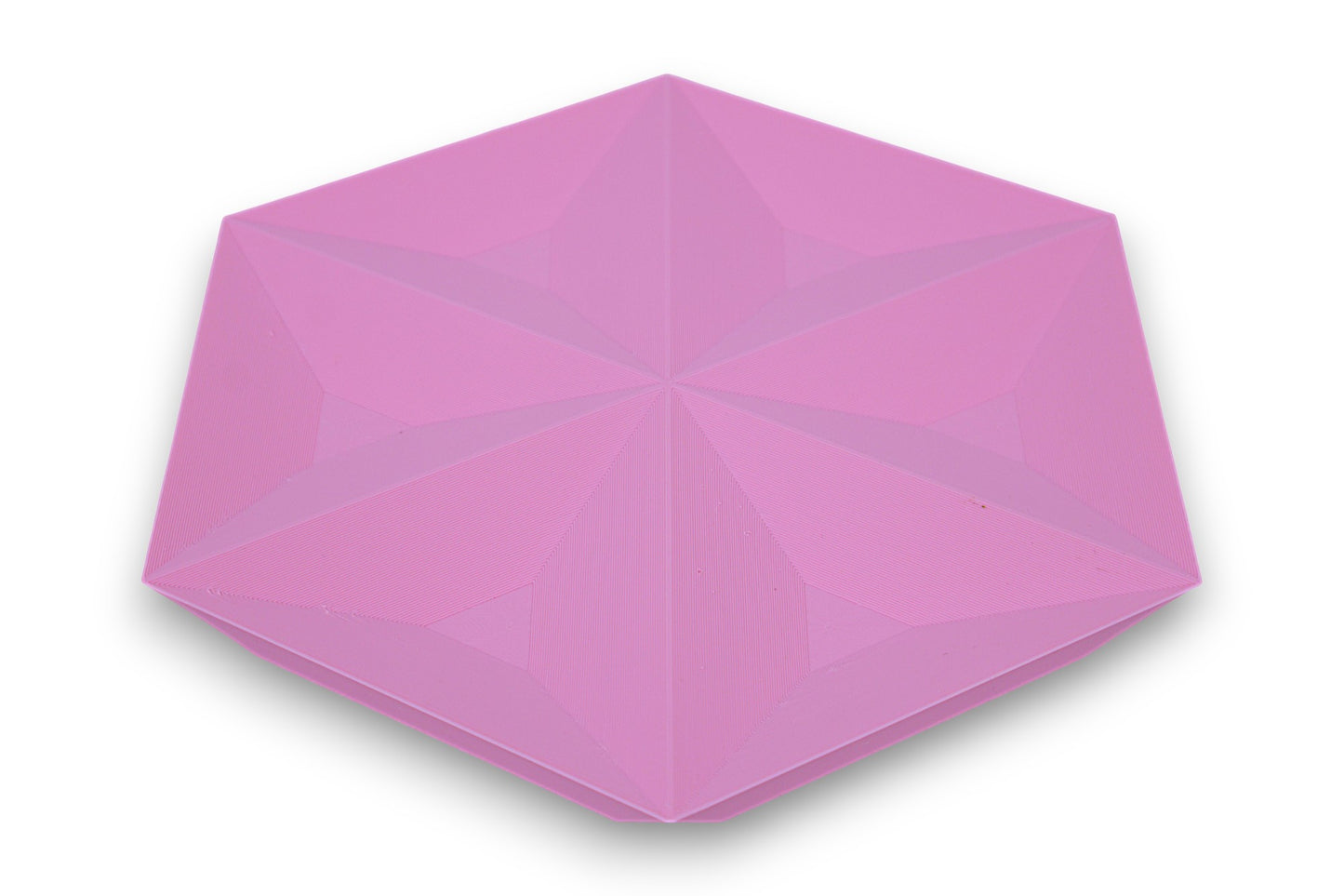 Pink catch-all tray with recessed triangular faces forming a star-like hexagonal pattern