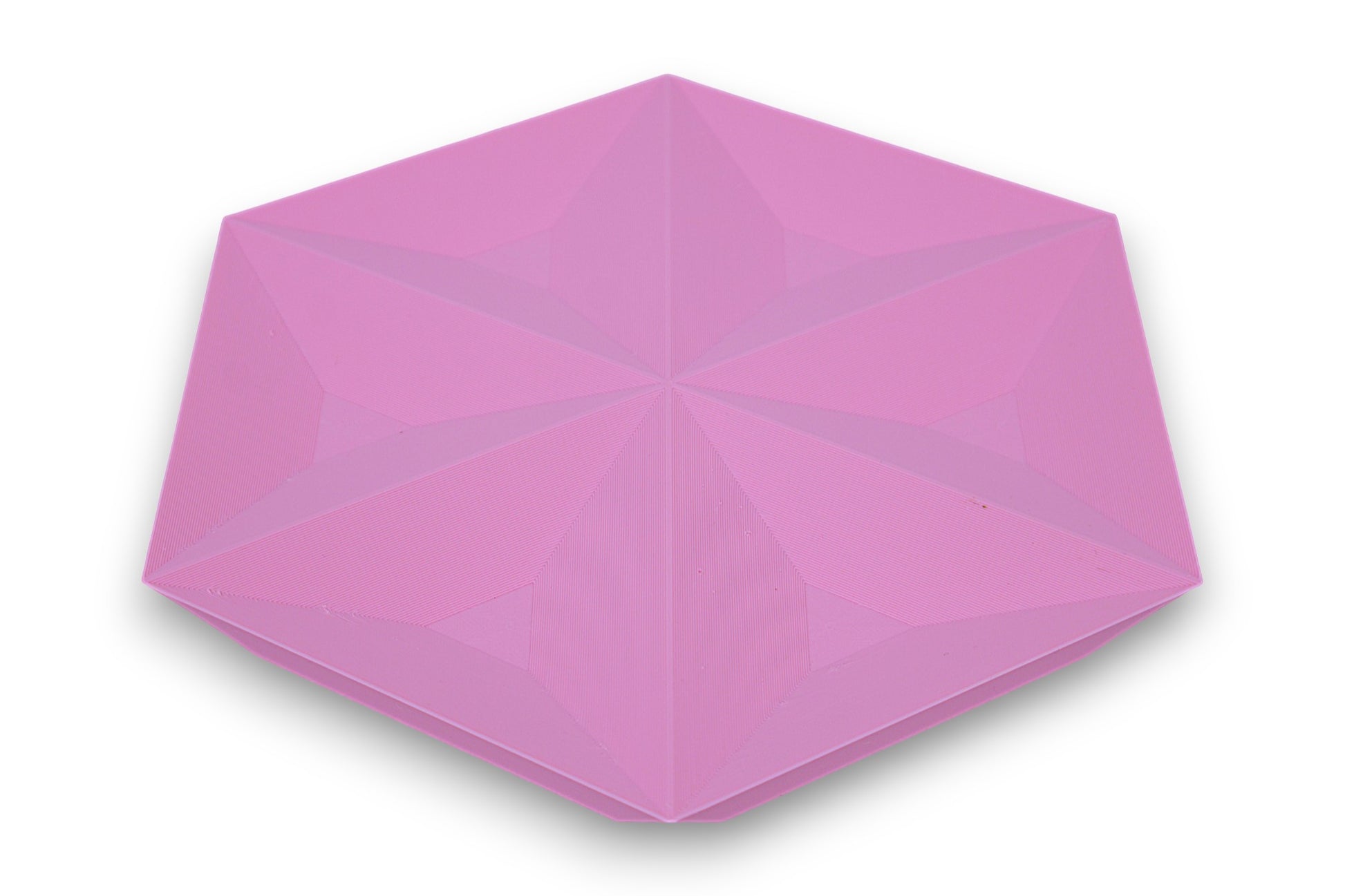 Pink catch-all tray with recessed triangular faces forming a star-like hexagonal pattern