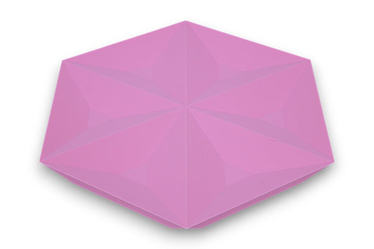 Pink catch-all tray with recessed triangular faces forming a star-like hexagonal pattern