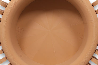 catch-all tray with smooth concave interior and radial vertical ridges