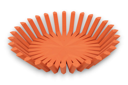 Terra cotta catch-all tray with circular base and vertical rectangular ridges around perimeter