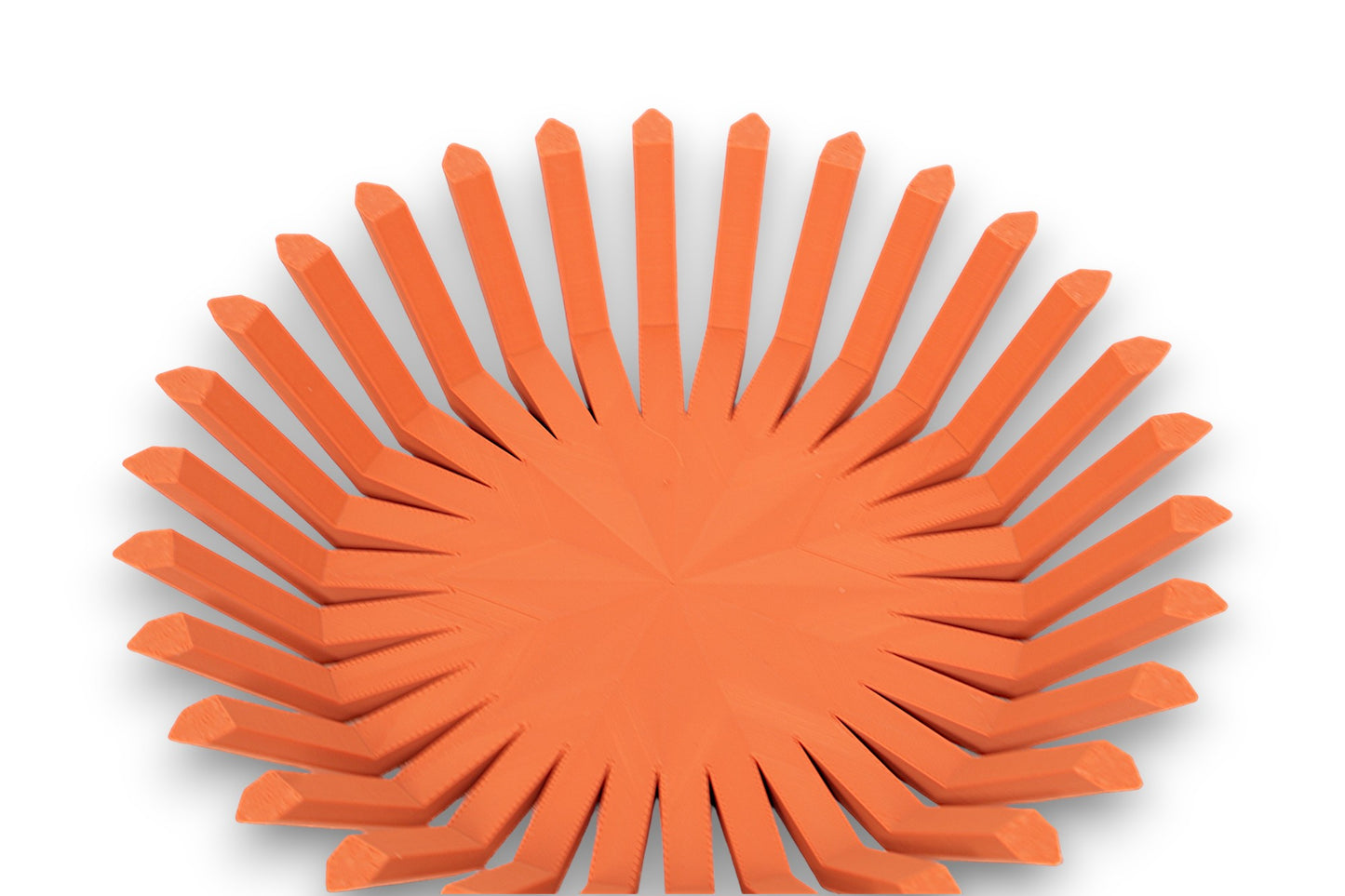 Terra cotta catch-all tray with circular base and vertical rectangular ridges around perimeter