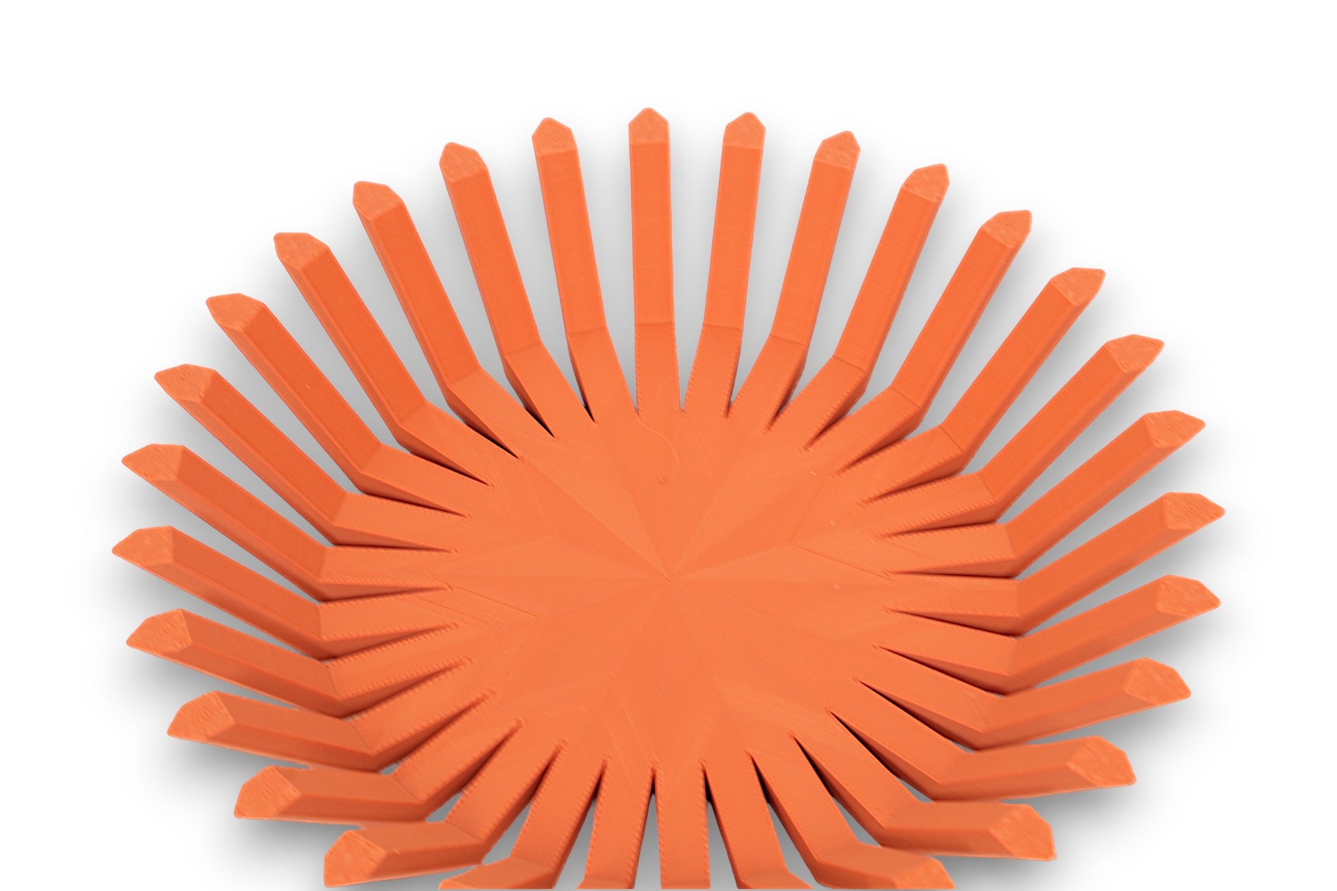 Terra cotta catch-all tray with circular base and vertical rectangular ridges around perimeter