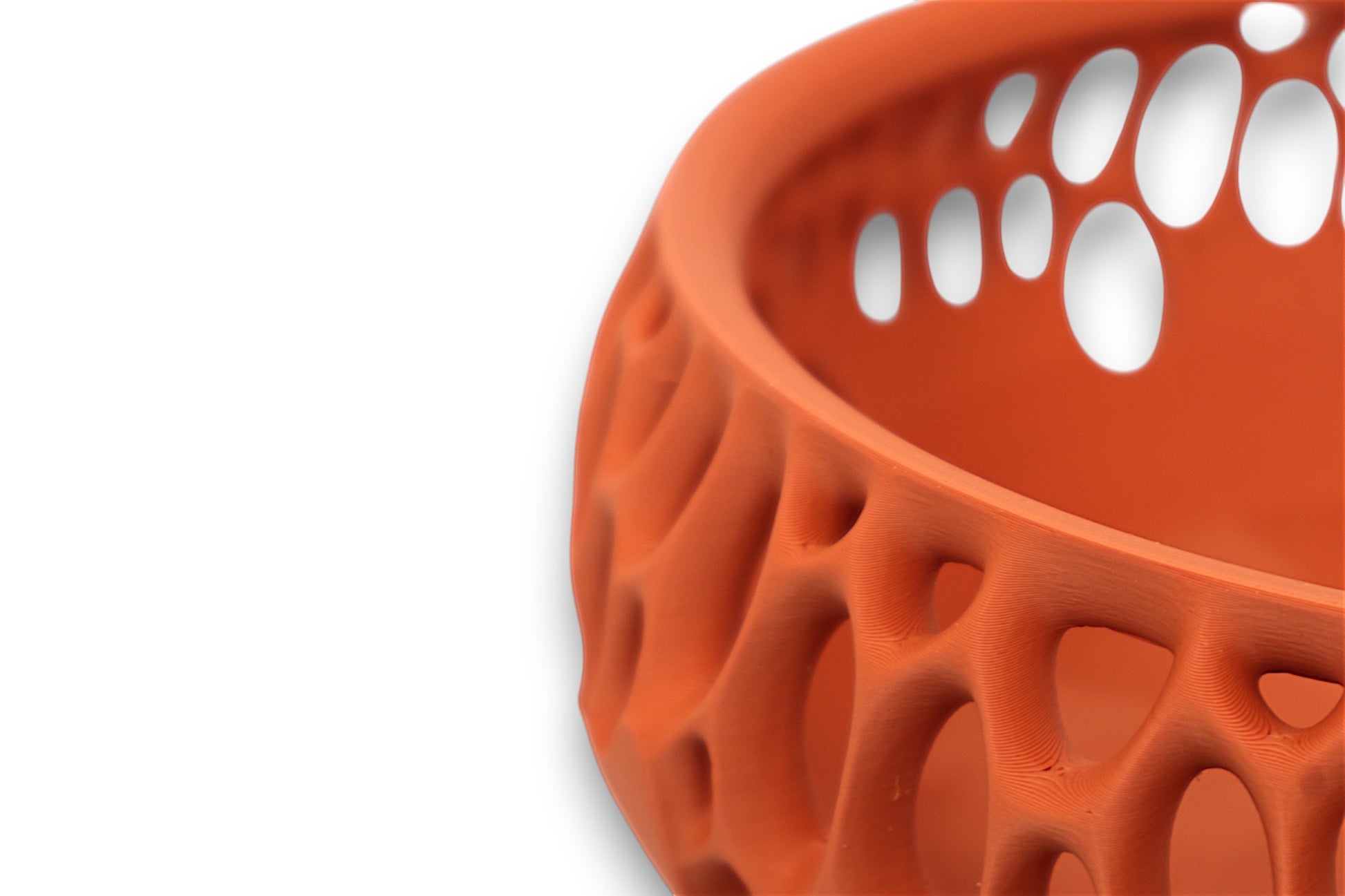 Terracotta catch-all tray with coral-like lattice pattern and smooth interior